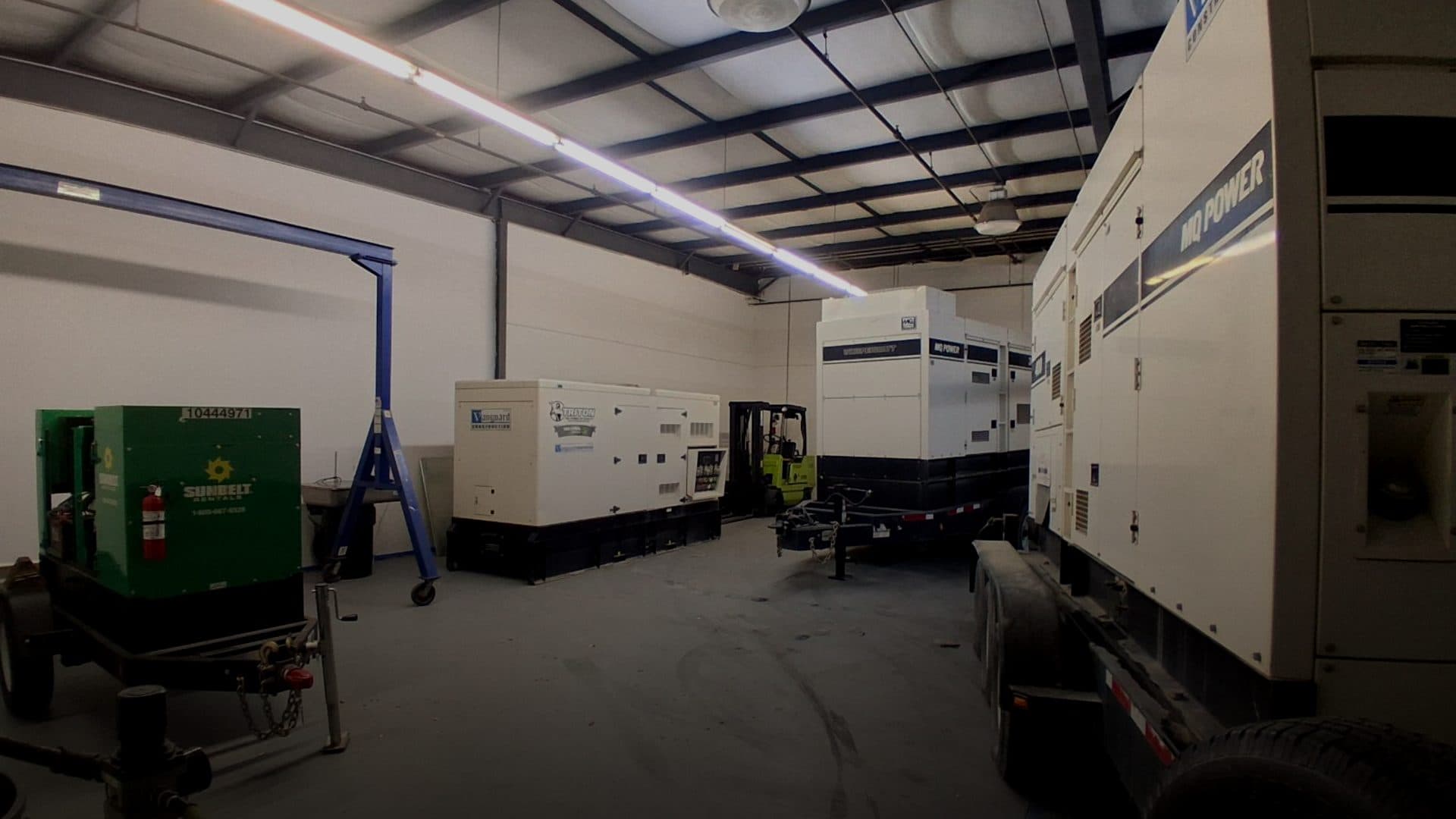 PowerGen warehouse with rental generator fleet staged for deployment